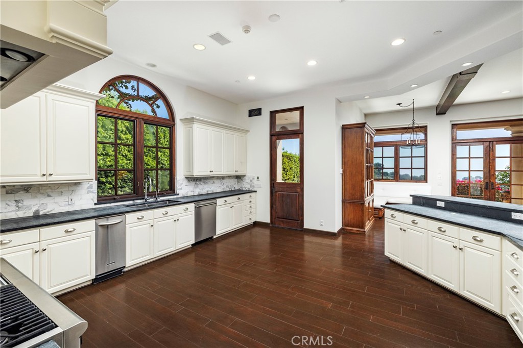 6 Premiere Point Newport Coast, CA 92657 - Photo 14 of 36 a large kitchen with granite countertop a large window a sink and stainless steel appliances