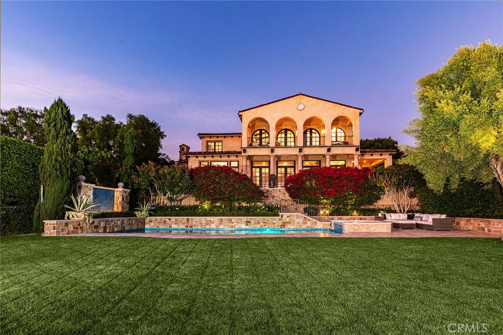 6 Premiere Point Newport Coast, CA 92657 - Photo 2 of 36 a front view of a house with a big yard