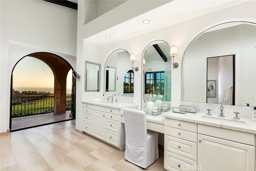6 Premiere Point Newport Coast, CA 92657 - Photo 22 of 36 a bathroom with a double vanity sink and mirror
