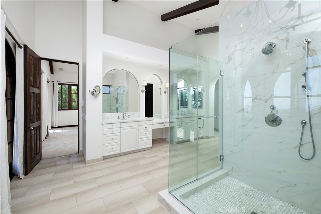 6 Premiere Point Newport Coast, CA 92657 - Photo 23 of 36 a bathroom with a double vanity sink mirror and shower