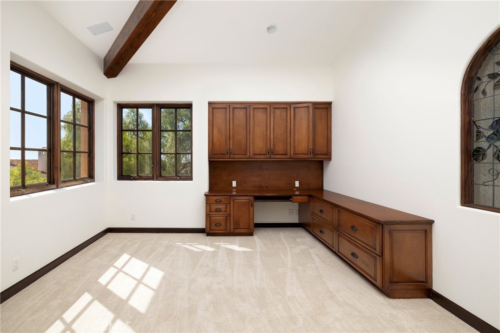 6 Premiere Point Newport Coast, CA 92657 - Photo 25 of 36 a kitchen with granite countertop a stove a microwave and a refrigerator with wooden floor
