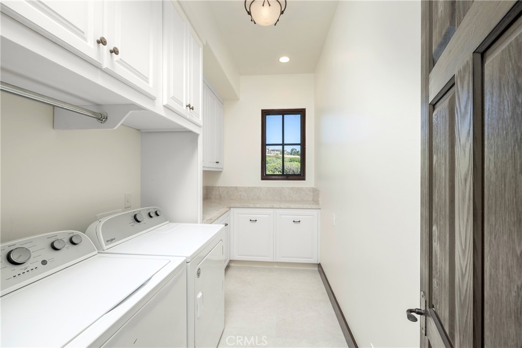 6 Premiere Point Newport Coast, CA 92657 - Photo 33 of 36 a room with a dryer and washer