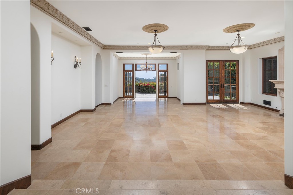 6 Premiere Point Newport Coast, CA 92657 - Photo 6 of 36 a view of an empty room with window and chandelier