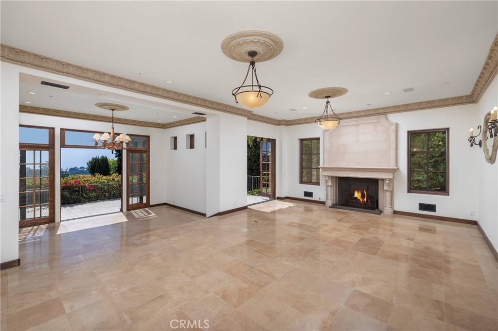 6 Premiere Point Newport Coast, CA 92657 - Photo 7 of 36 a view of an empty room with fireplace and a window