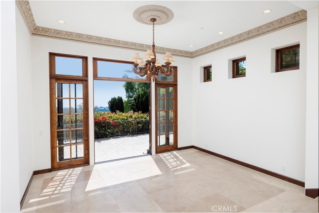 6 Premiere Point Newport Coast, CA 92657 - Photo 8 of 36 a view of a room with a chandelier and glass door
