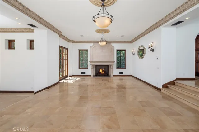 a view of an empty room with a fireplace