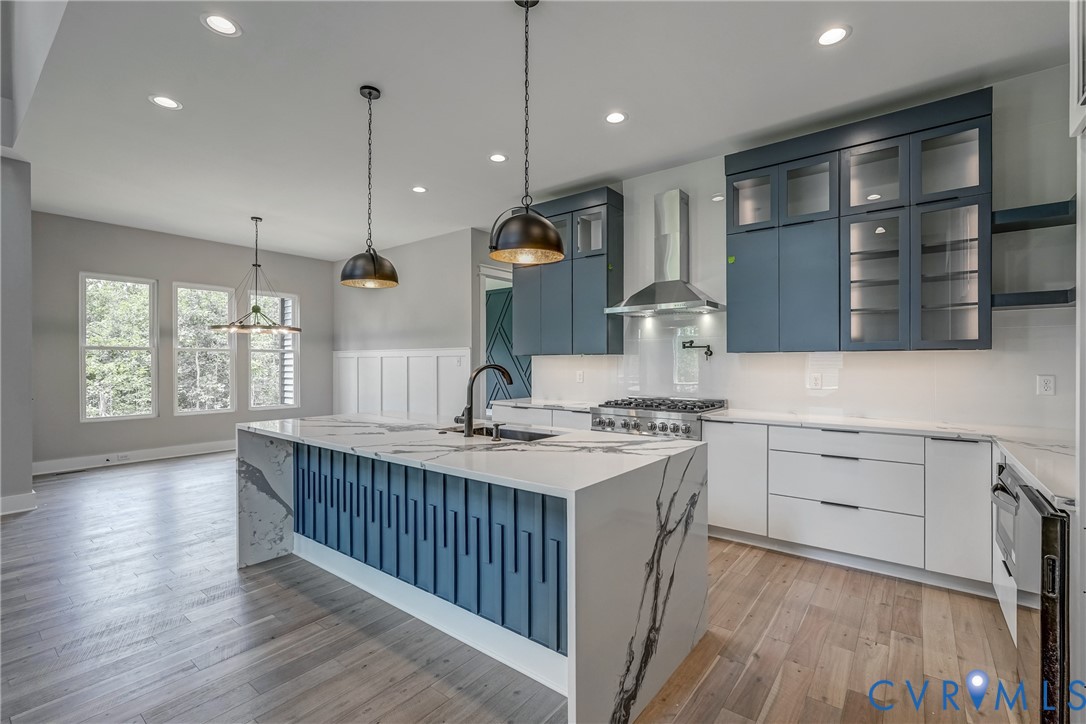 3519 Ampfield Way Midlothian, VA 23112 - Photo 3 of 18 a kitchen that has a lot of cabinets in it and wooden floors