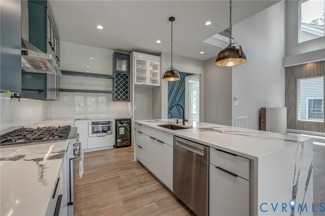 3519 Ampfield Way Midlothian, VA 23112 - Photo 5 of 18 a kitchen with stainless steel appliances granite countertop a sink a stove and a wooden floors