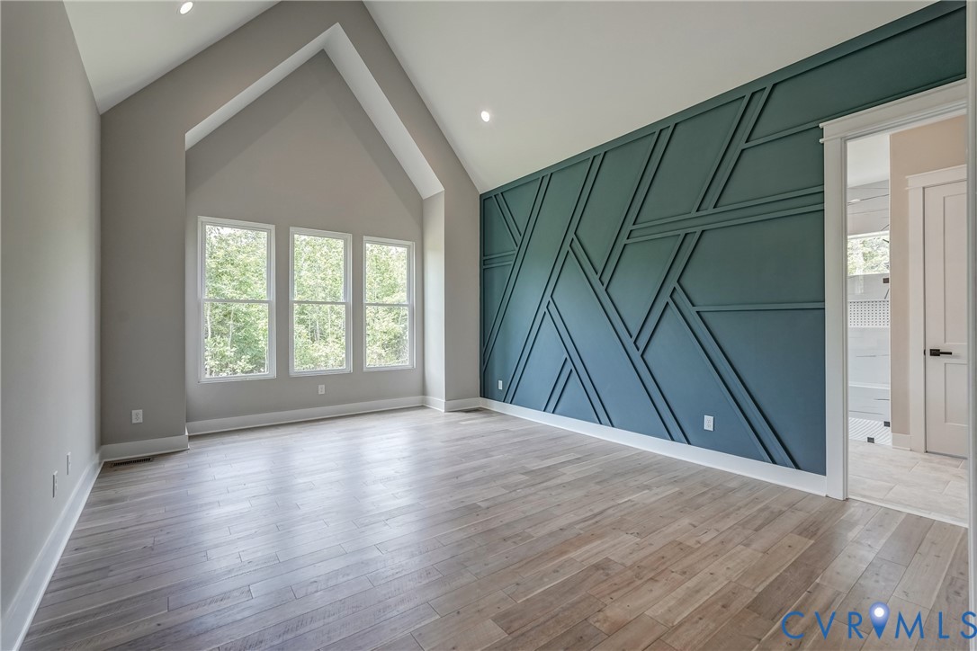 3519 Ampfield Way Midlothian, VA 23112 - Photo 9 of 18 an empty room with wooden floor and windows