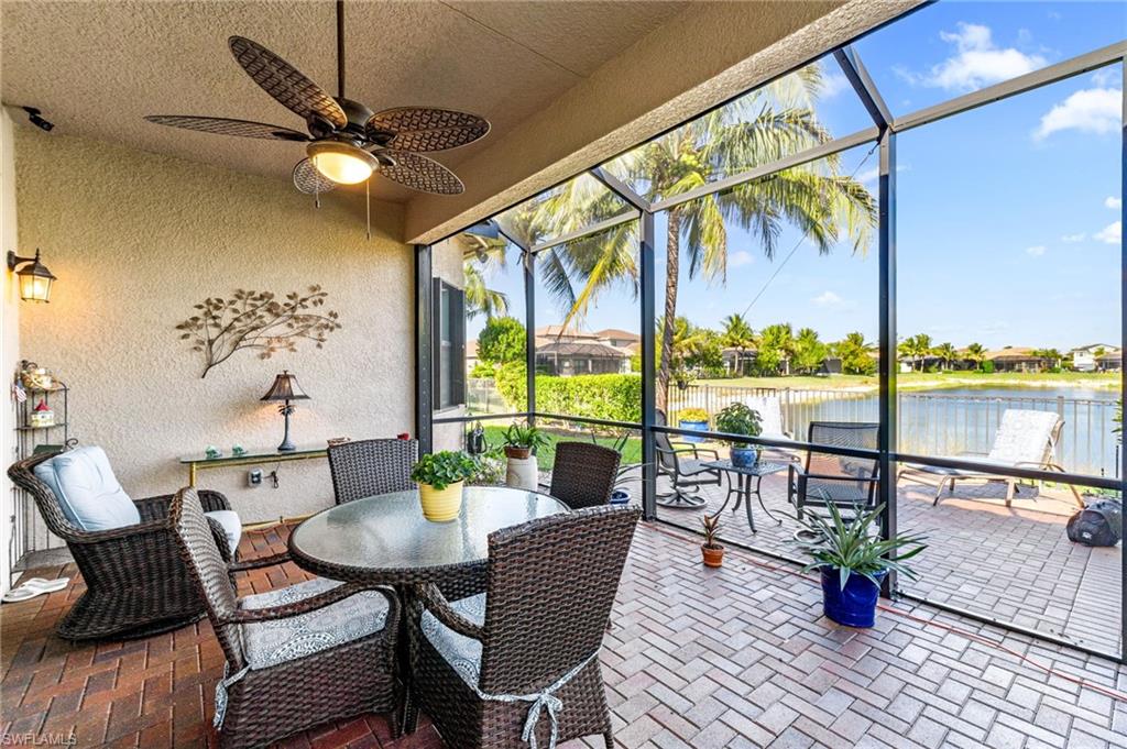 a dining room with furniture water view and wooden floor