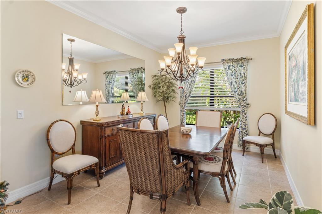 4339 Aurora Street Naples, FL 34119 - Photo 16 of 47 a view of a dining room with furniture window and wooden floor