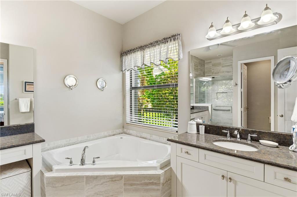 4339 Aurora Street Naples, FL 34119 - Photo 21 of 47 a bathroom with a bathtub and a sink