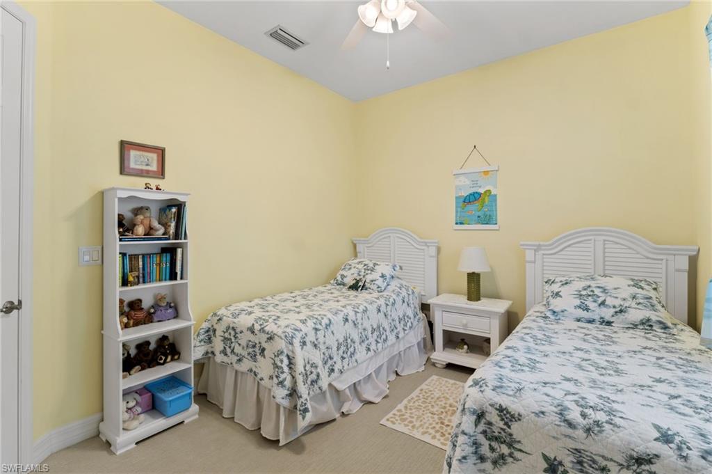 4339 Aurora Street Naples, FL 34119 - Photo 26 of 47 a bedroom with two beds and painting on the wall