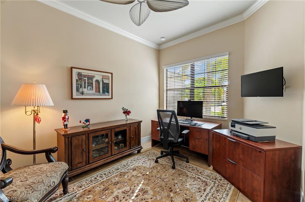 4339 Aurora Street Naples, FL 34119 - Photo 27 of 47 a view of a workspace with furniture and a window