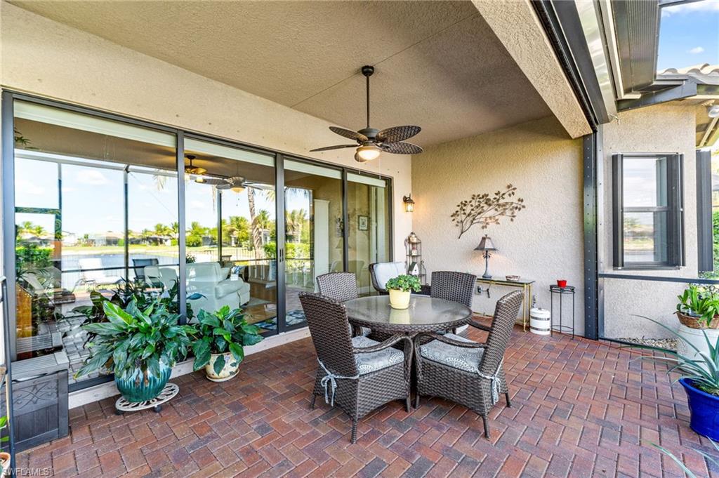 4339 Aurora Street Naples, FL 34119 - Photo 33 of 47 a dining room with furniture window and wooden floor