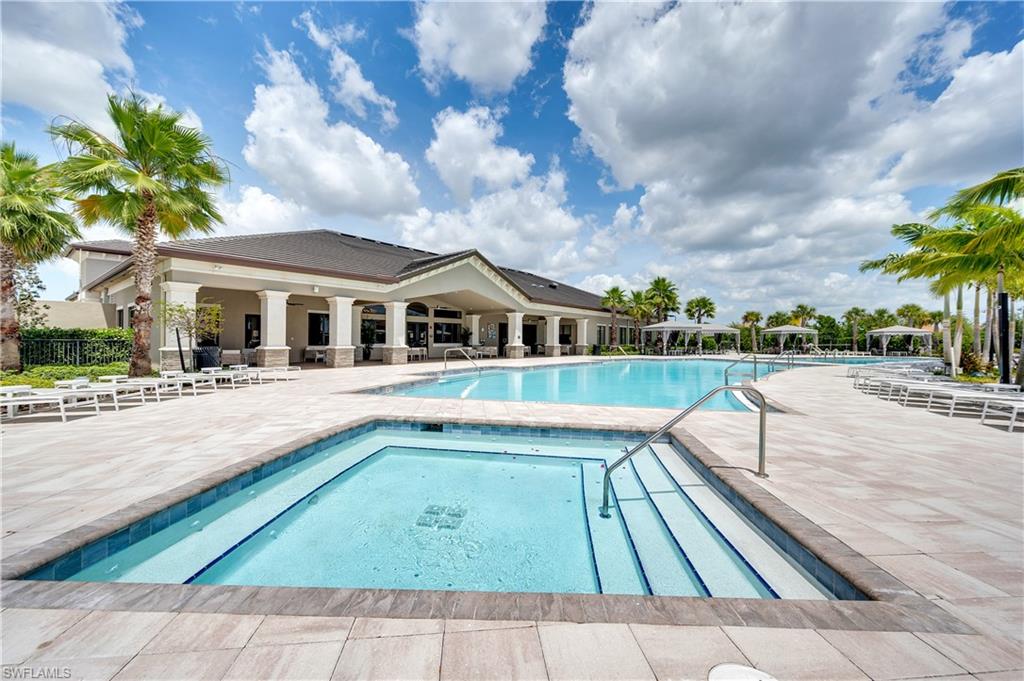 4339 Aurora Street Naples, FL 34119 - Photo 42 of 47 a view of house with swimming pool and sitting area