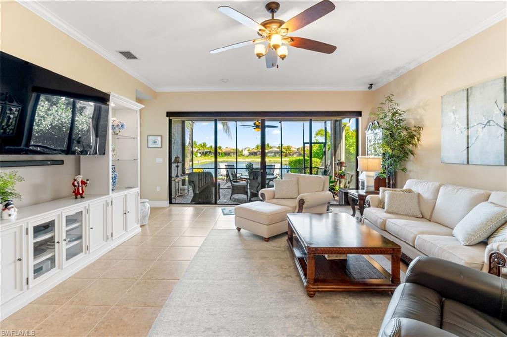 4339 Aurora Street Naples, FL 34119 - Photo 8 of 47 a living room with furniture and a large window