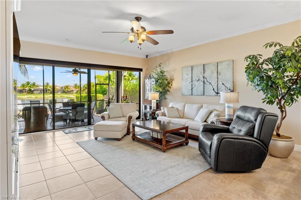 4339 Aurora Street Naples, FL 34119 - Photo 9 of 47 a living room with furniture and a large window