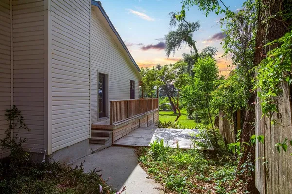 a backyard of a house with lots of green space
