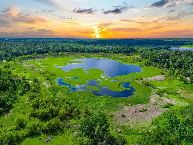 a view of a lake with a yard