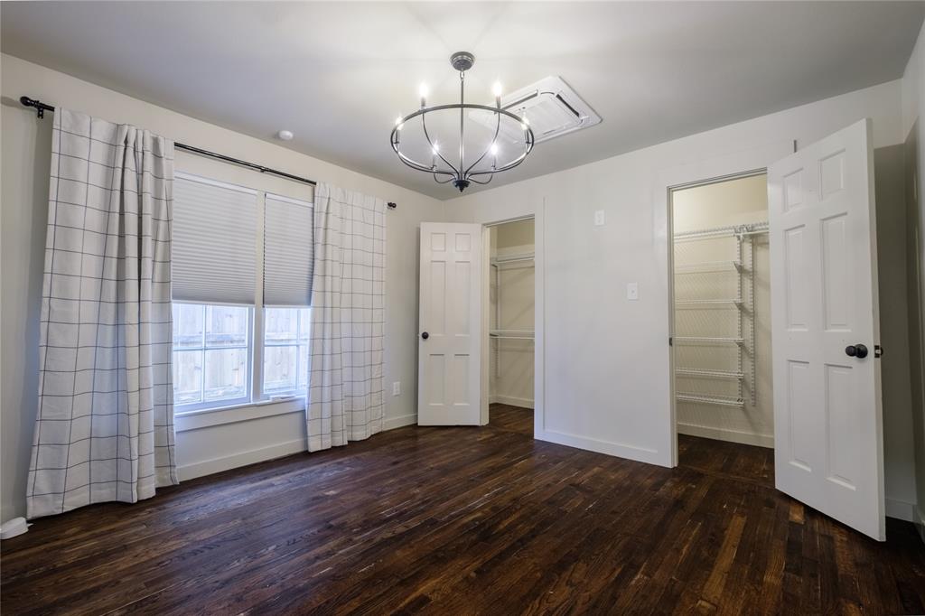 2040 South 9th Street Waco, TX 76706 - Photo 14 of 25 an empty room with wooden floor mirror and windows