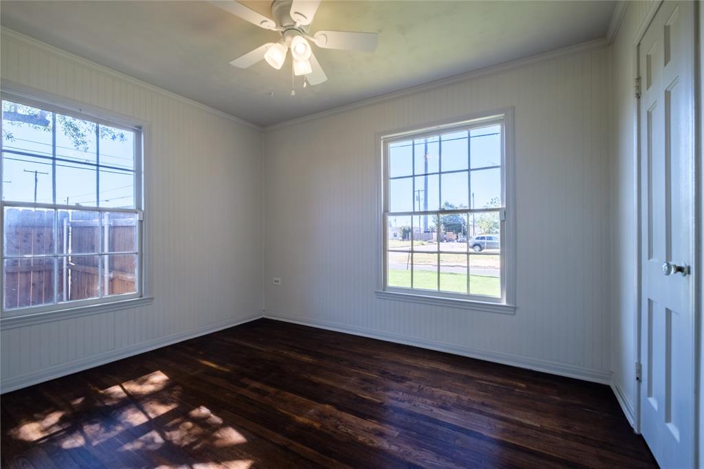 2040 South 9th Street Waco, TX 76706 - Photo 20 of 25 a view of an empty room with wooden floor and a window
