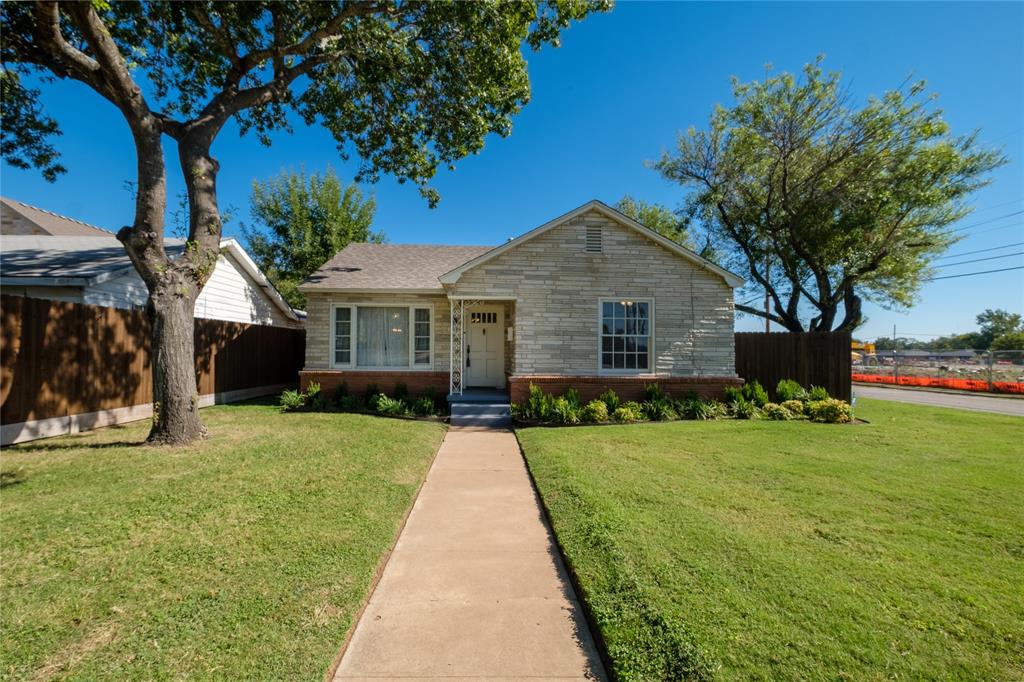 2040 South 9th Street Waco, TX 76706 - Photo 10 of 25 a front view of a house with a yard and trees