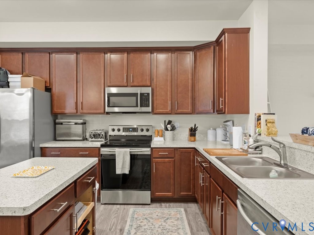 12137 Perdue Springs Loop Chester, VA 23831 - Photo 14 of 45 Kitchen with stainless steel appliances, light cou
