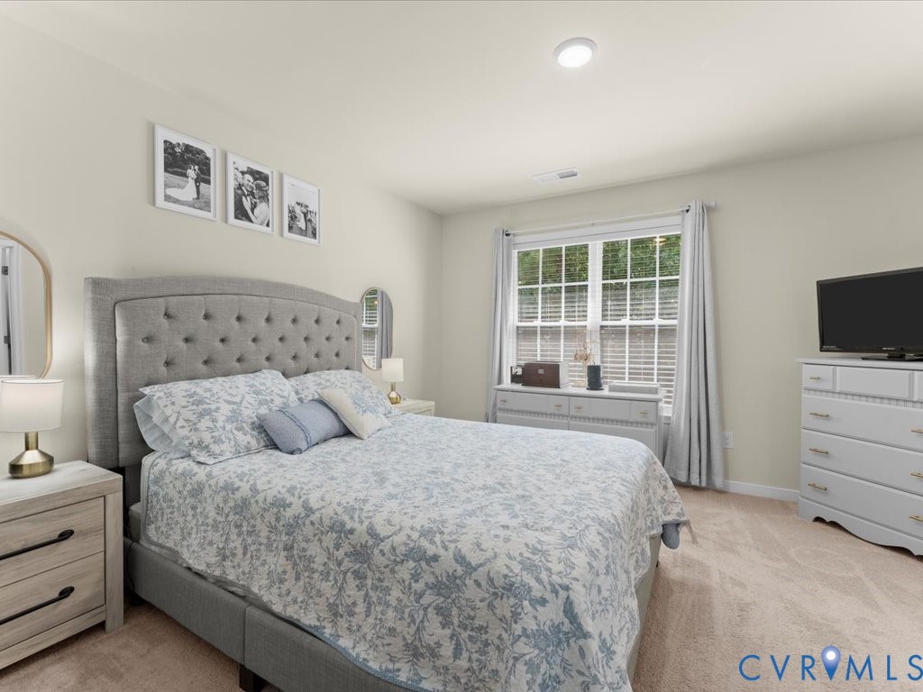 12137 Perdue Springs Loop Chester, VA 23831 - Photo 24 of 45 Bedroom with light colored carpet and recessed lig