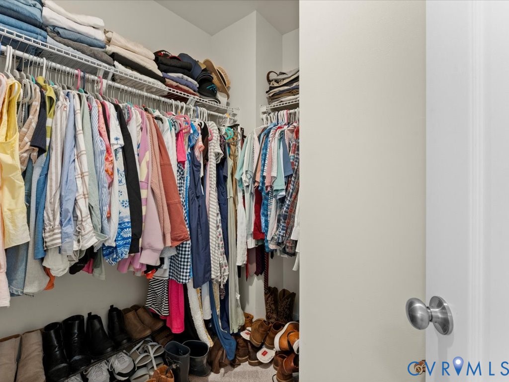 12137 Perdue Springs Loop Chester, VA 23831 - Photo 29 of 45 View of walk in closet - primary bedroom