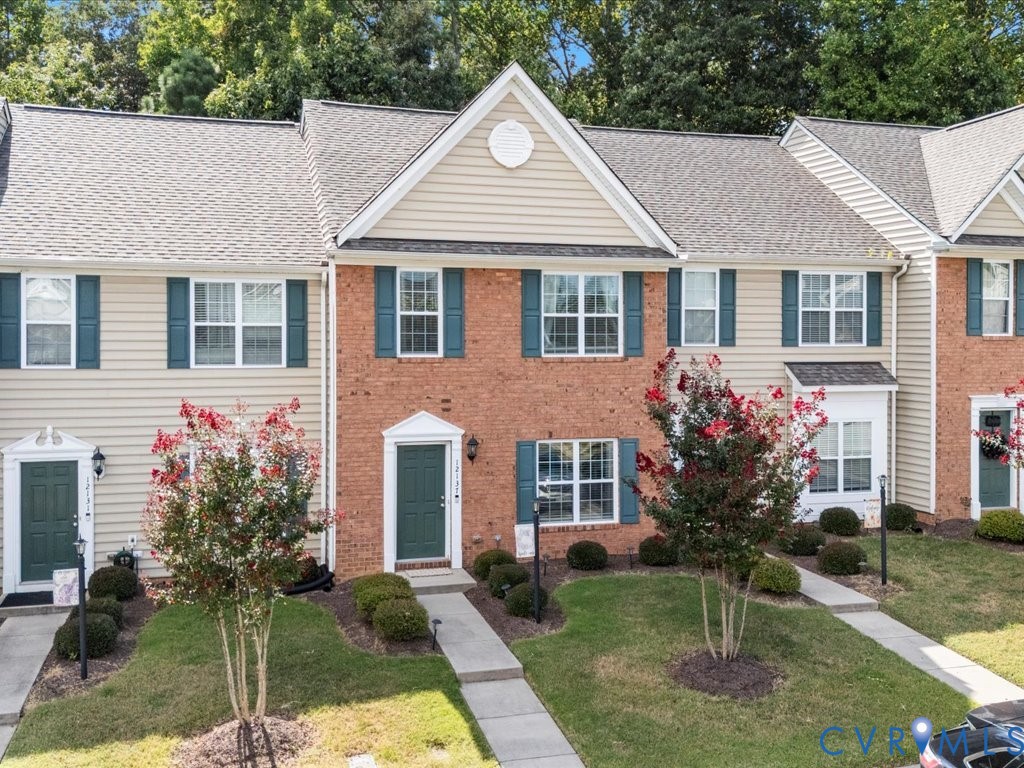 12137 Perdue Springs Loop Chester, VA 23831 - Photo 3 of 45 Colonial house with a front lawn, roof with shingl