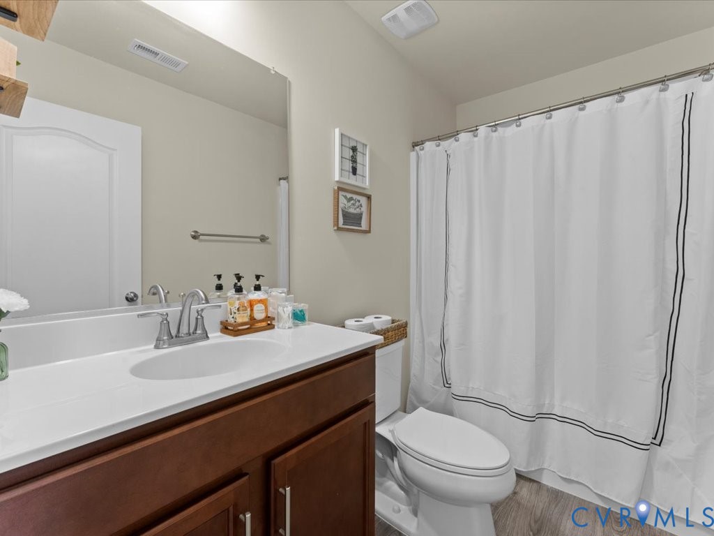 12137 Perdue Springs Loop Chester, VA 23831 - Photo 35 of 45 Bathroom with vanity, light wood finished floors,