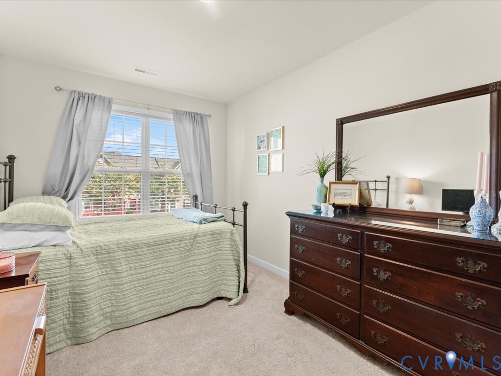 12137 Perdue Springs Loop Chester, VA 23831 - Photo 37 of 45 Bedroom with light carpet and baseboards