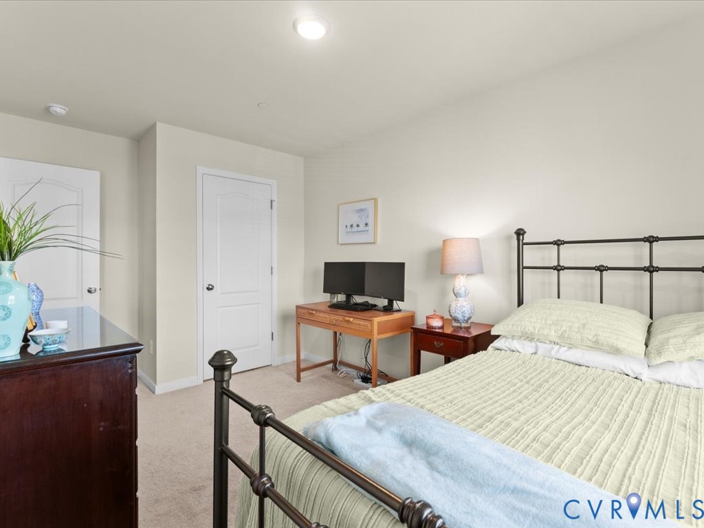 12137 Perdue Springs Loop Chester, VA 23831 - Photo 38 of 45 Bedroom with light carpet and baseboards