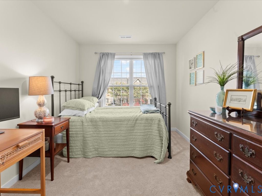 12137 Perdue Springs Loop Chester, VA 23831 - Photo 39 of 45 Bedroom featuring light colored carpet and baseboa