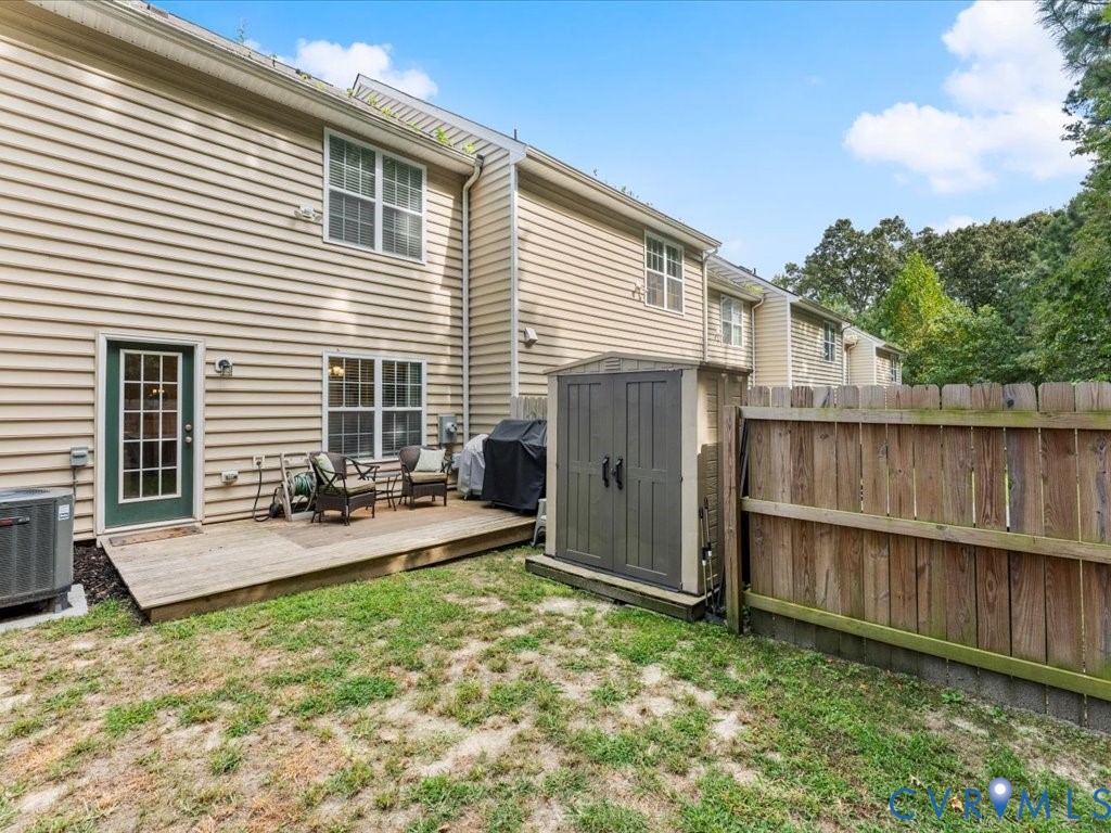 12137 Perdue Springs Loop Chester, VA 23831 - Photo 42 of 45 Back of house featuring a storage shed and a woode