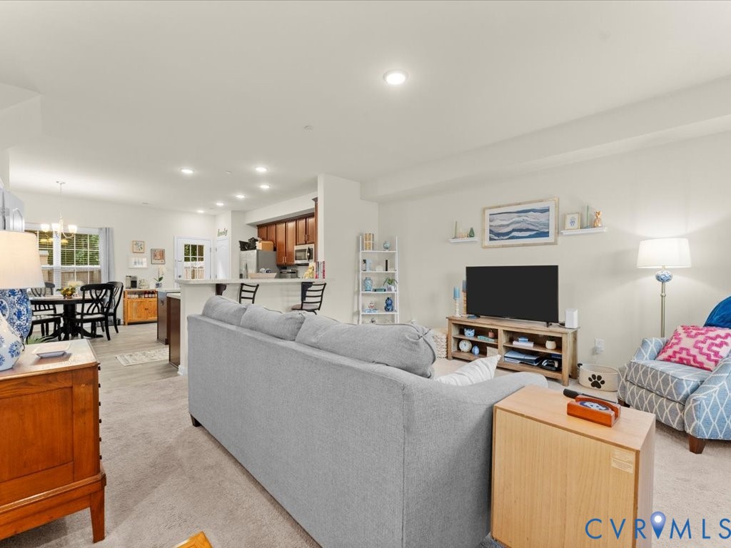 12137 Perdue Springs Loop Chester, VA 23831 - Photo 8 of 45 Living area with recessed lighting, light carpet,