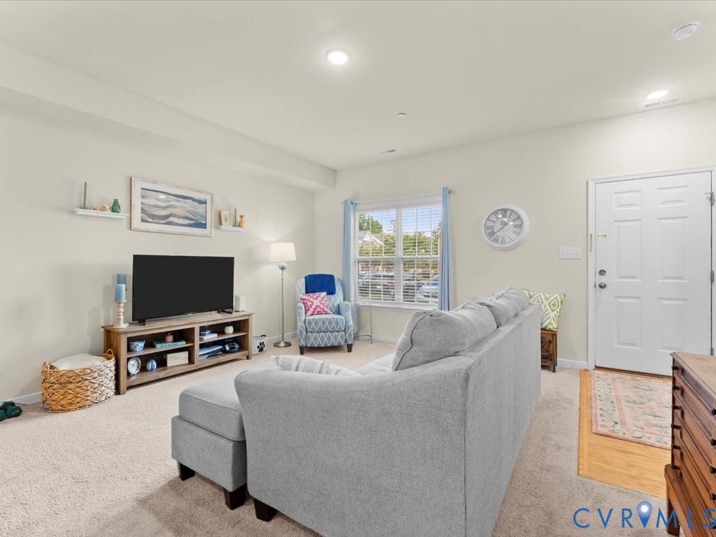 12137 Perdue Springs Loop Chester, VA 23831 - Photo 10 of 45 Living room with light colored carpet and recessed