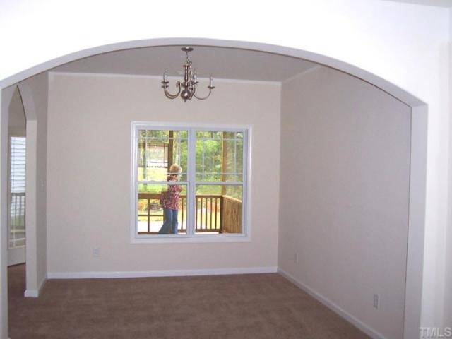 3219 Sunbright Lane Raleigh, NC 27610 - Photo 3 of 11 an empty room with windows
