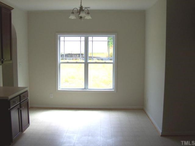3219 Sunbright Lane Raleigh, NC 27610 - Photo 5 of 11 a view of an empty room with a window