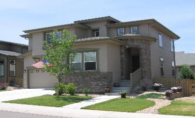 10835 Towerbridge Road Highlands Ranch, CO 80130 - Photo 1 of 1 a front view of a house with a yard