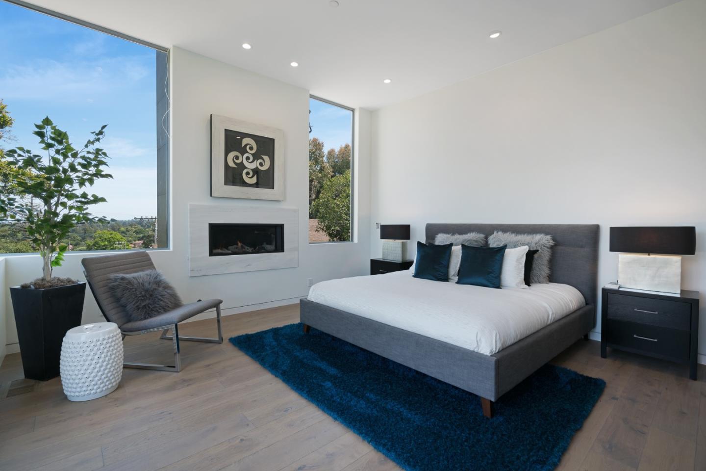 2841 Hillside Drive Burlingame, CA 94010 - Photo 13 of 38 a spacious bedroom with a bed and a chair