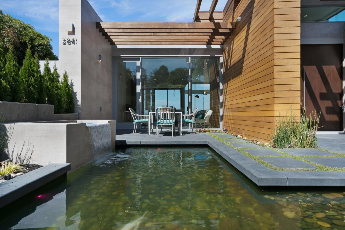 2841 Hillside Drive Burlingame, CA 94010 - Photo 5 of 38 a view of a swimming pool with a patio