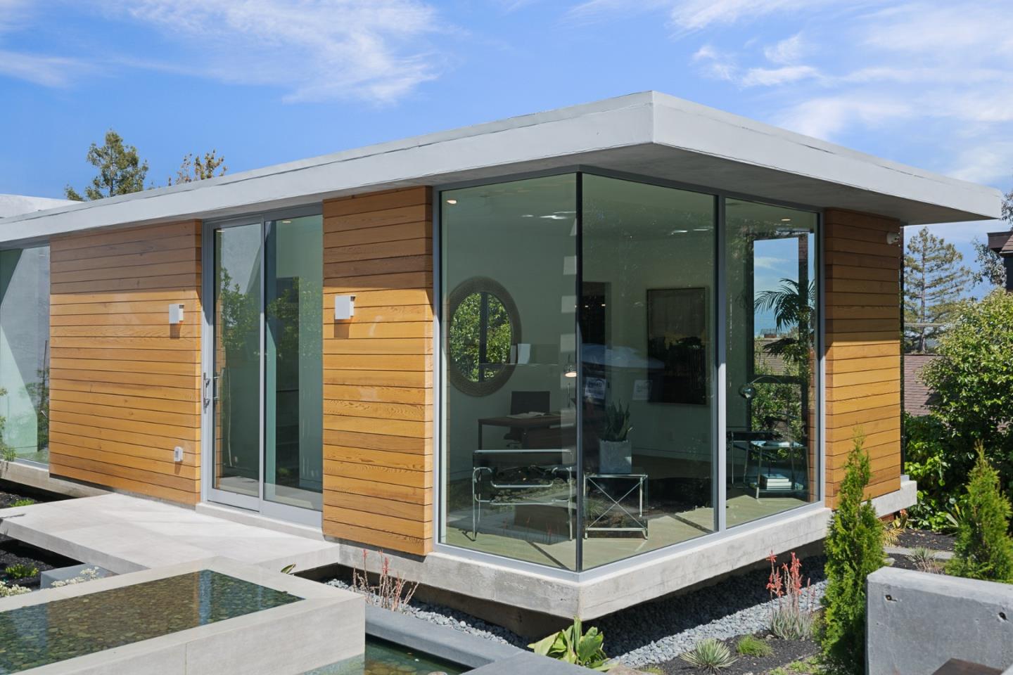2841 Hillside Drive Burlingame, CA 94010 - Photo 6 of 38 a front view of a house with a glass door