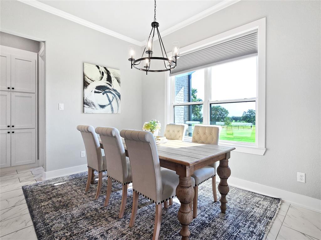 1008 Henry Way Springtown, TX 76082 - Photo 13 of 40 a view of a dining room with furniture window and wooden floor