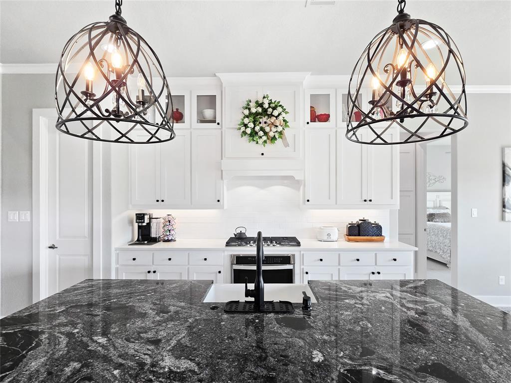 1008 Henry Way Springtown, TX 76082 - Photo 16 of 40 a bedroom with a bed and cabinets