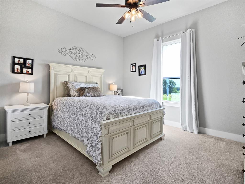 1008 Henry Way Springtown, TX 76082 - Photo 19 of 40 a bedroom with a bed and window