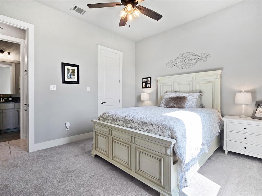1008 Henry Way Springtown, TX 76082 - Photo 20 of 40 a bedroom with a bed and a ceiling fan