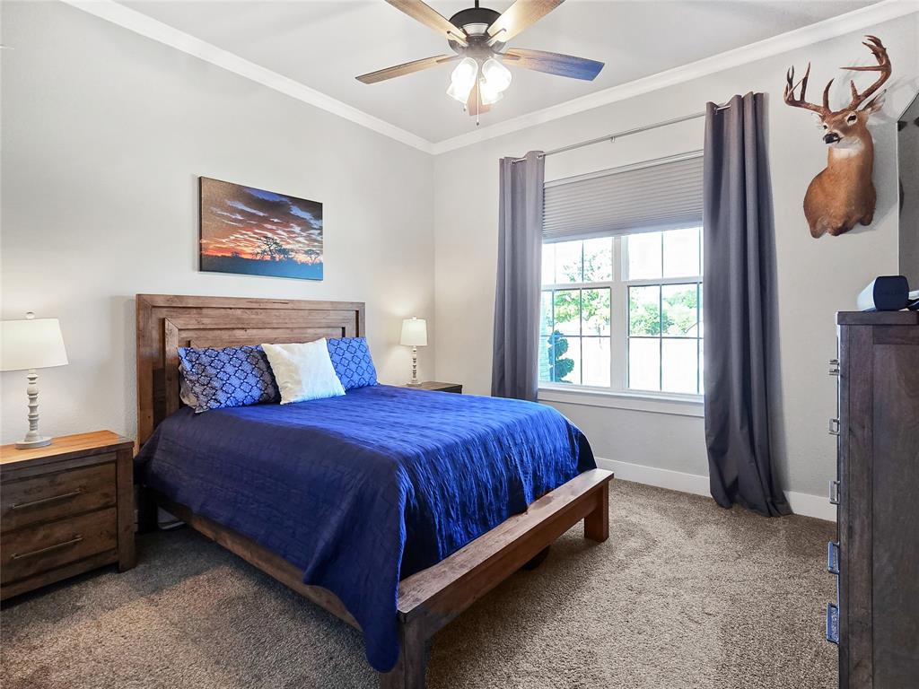 1008 Henry Way Springtown, TX 76082 - Photo 22 of 40 a bedroom with a bed and window