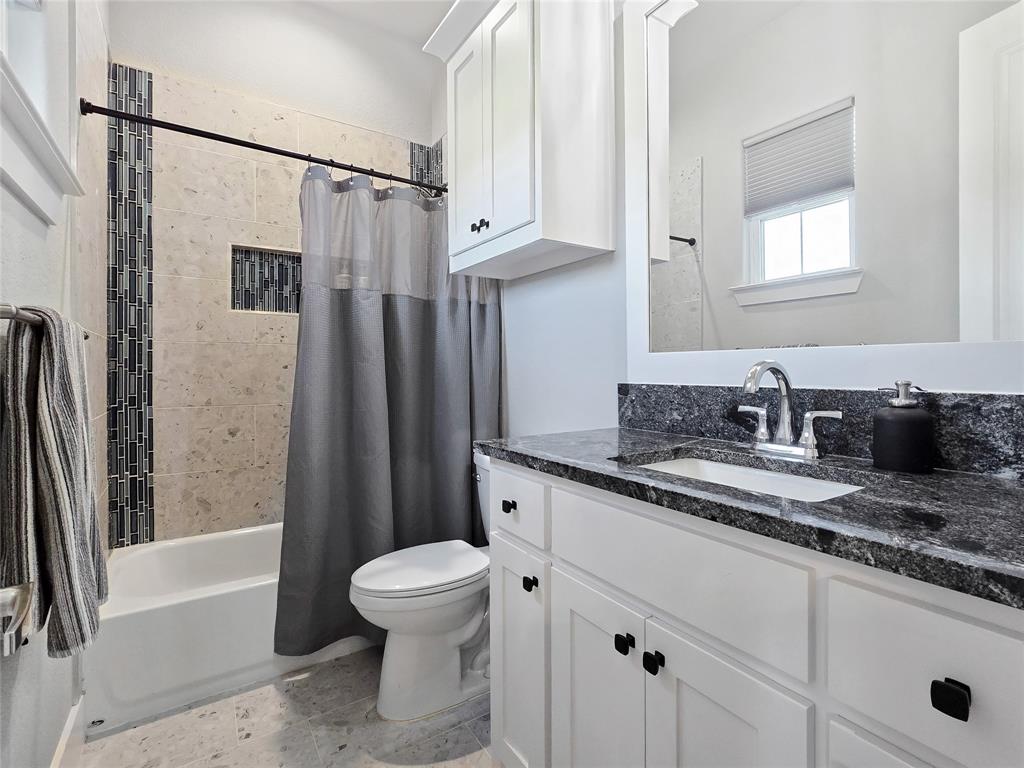 1008 Henry Way Springtown, TX 76082 - Photo 24 of 40 a bathroom with a granite countertop sink toilet and shower